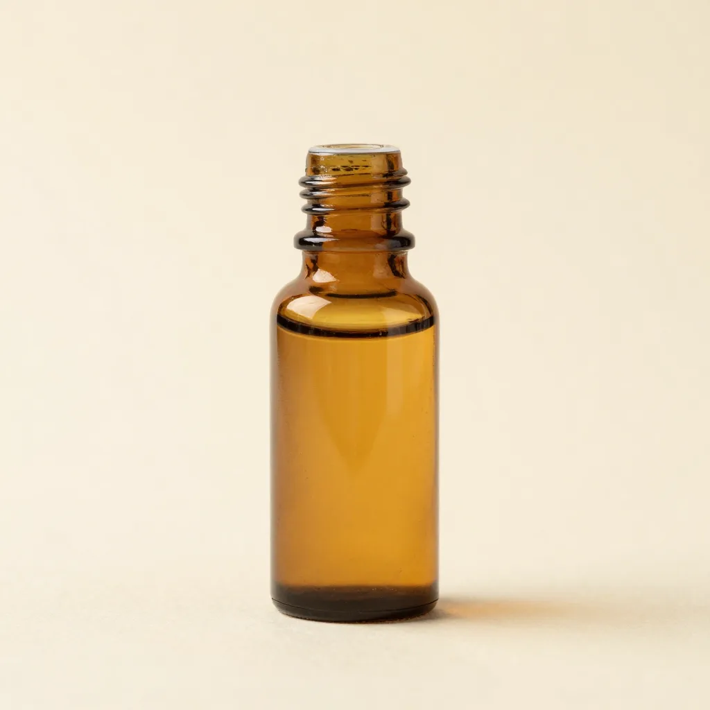 A small glass bottle of golden chamomile essential oil